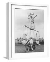 Motorcycle Acrobat Troupe Called "The Promenade Percies" Practise Their Act Involving Balance-null-Framed Photographic Print