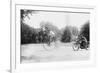 Motorcycle Cop Chases a Penny Farthing Velocipede Down a DC Street with Washington Monument in Back-null-Framed Art Print