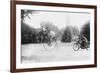 Motorcycle Cop Chases a Penny Farthing Velocipede Down a DC Street with Washington Monument in Back-null-Framed Art Print