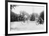 Motorcycle Cop Chases a Penny Farthing Velocipede Down a DC Street with Washington Monument in Back-null-Framed Art Print