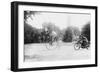 Motorcycle Cop Chases a Penny Farthing Velocipede Down a DC Street with Washington Monument in Back-null-Framed Art Print