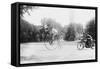 Motorcycle Cop Chases a Penny Farthing Velocipede Down a DC Street with Washington Monument in Back-null-Framed Stretched Canvas