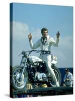 Motorcycle Daredevil Evel Knievel Poised on His Harley Davidson-Ralph Crane-Stretched Canvas