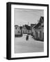 Motorcycle Going Down Street in Small Town-null-Framed Photographic Print