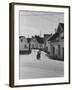 Motorcycle Going Down Street in Small Town-null-Framed Photographic Print