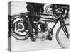 Motorcyclist Holding Rudge Motorcycle-null-Stretched Canvas