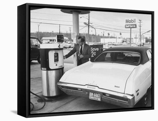 Motorist Filling Up His Own Car at a Self Service Gas Station-Ralph Morse-Framed Stretched Canvas