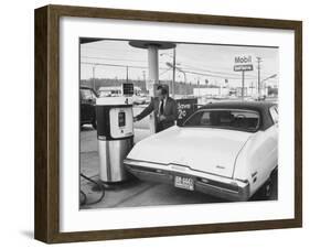 Motorist Filling Up His Own Car at a Self Service Gas Station-Ralph Morse-Framed Photographic Print