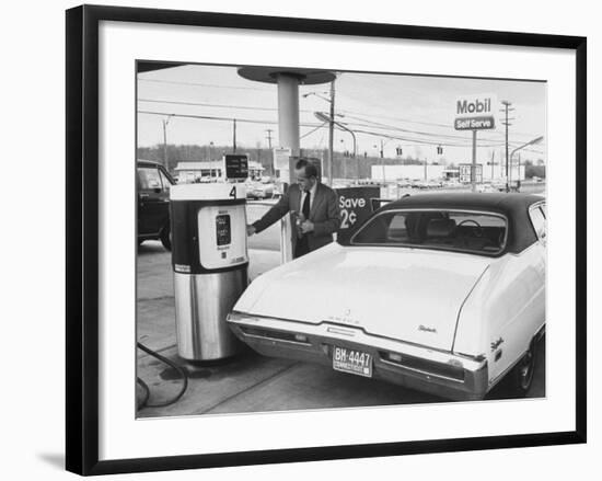 Motorist Filling Up His Own Car at a Self Service Gas Station-Ralph Morse-Framed Photographic Print