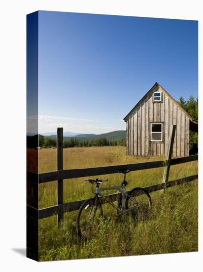 Mountain bike and barn on Birch Hill, New Durham, New Hampshire, USA-Jerry & Marcy Monkman-Stretched Canvas