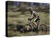 Mountain Biker Against a Blurry Background, Mt. Bike-Michael Brown-Stretched Canvas