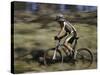 Mountain Biker Against a Blurry Background, Mt. Bike-Michael Brown-Stretched Canvas