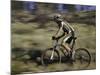 Mountain Biker Against a Blurry Background, Mt. Bike-Michael Brown-Mounted Photographic Print