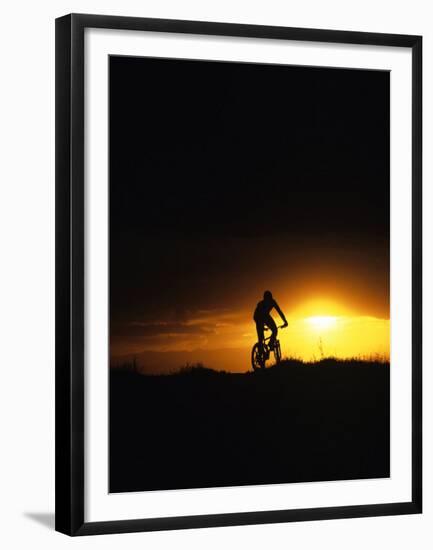 Mountain Biker Against Stormy Sunset, Fruita, Colorado, USA-Chuck Haney-Framed Premium Photographic Print