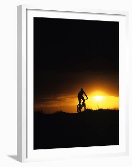 Mountain Biker Against Stormy Sunset, Fruita, Colorado, USA-Chuck Haney-Framed Premium Photographic Print