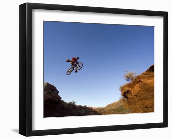 Mountain Biker Catches Air at Rampage Site near Virgin, Utah, USA-Chuck Haney-Framed Photographic Print