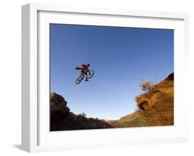 Mountain Biker Catches Air at Rampage Site near Virgin, Utah, USA-Chuck Haney-Framed Photographic Print