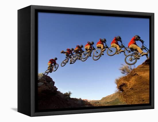 Mountain Biker Catches Air at Rampage Site near Virgin, Utah, USA-Chuck Haney-Framed Stretched Canvas