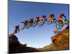 Mountain Biker Catches Air at Rampage Site near Virgin, Utah, USA-Chuck Haney-Mounted Photographic Print