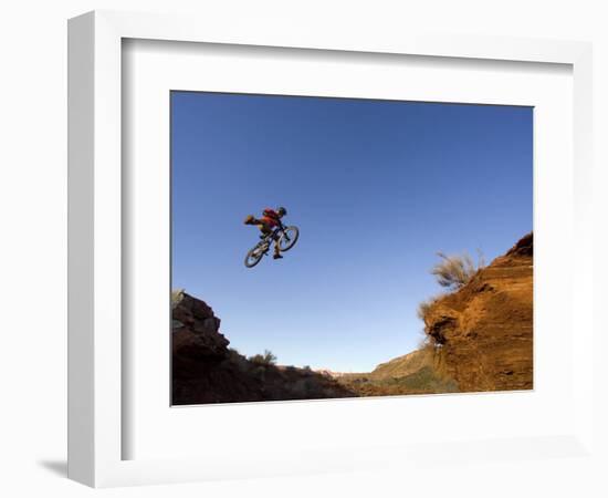 Mountain Biker Catches Air at Rampage Site near Virgin, Utah, USA-Chuck Haney-Framed Photographic Print