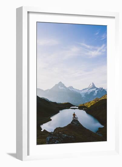 Mountain biker looking at Bachalpsee lake and Bernese Oberland mountains at dawn-Roberto Moiola-Framed Photographic Print