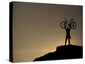 Mountain Biker on Cliffs, Turnagain Arm, Alaska, USA-Paul Souders-Stretched Canvas