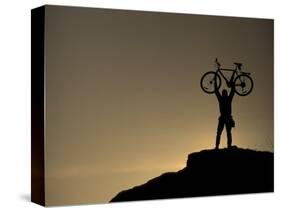 Mountain Biker on Cliffs, Turnagain Arm, Alaska, USA-Paul Souders-Stretched Canvas