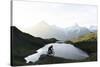 Mountain biker riding downhill at Bachalpsee lake at dawn, Grindelwald, Bernese Oberland-Roberto Moiola-Stretched Canvas