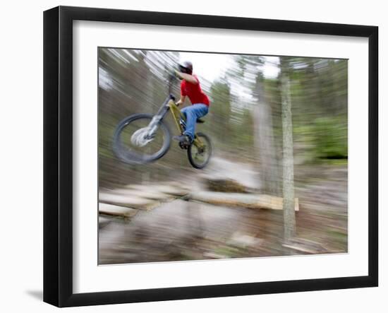 Mountain Biker Riding Stunts in Whitefish, Montana, USA-Chuck Haney-Framed Photographic Print