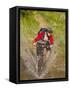 Mountain Biker Splashes Through Andrews Creek, Maah Daah Hey Trail in Medora, North Dakota, USA-Chuck Haney-Framed Stretched Canvas