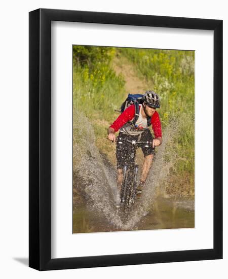 Mountain Biker Splashes Through Andrews Creek, Maah Daah Hey Trail in Medora, North Dakota, USA-Chuck Haney-Framed Premium Photographic Print
