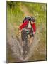 Mountain Biker Splashes Through Andrews Creek, Maah Daah Hey Trail in Medora, North Dakota, USA-Chuck Haney-Mounted Photographic Print