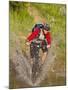 Mountain Biker Splashes Through Andrews Creek, Maah Daah Hey Trail in Medora, North Dakota, USA-Chuck Haney-Mounted Photographic Print