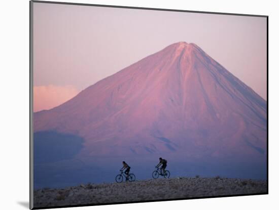 Mountain Biking in Atacama Desert Against a Backdrop of Perfect Cone of Volcan Licancabur 5916 M-John Warburton-lee-Mounted Photographic Print