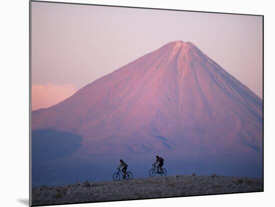 Mountain Biking in Atacama Desert Against a Backdrop of Perfect Cone of Volcan Licancabur 5916 M-John Warburton-lee-Mounted Photographic Print