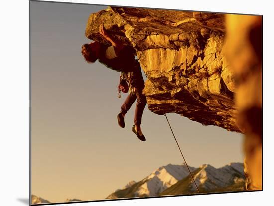 Mountain Climber Hanging from a Rock-null-Mounted Photographic Print