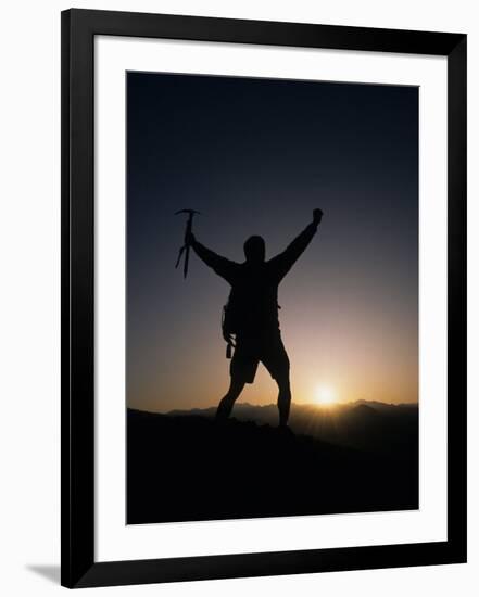 Mountain Climber Rejoices at the Summit at Sunrise-null-Framed Photographic Print