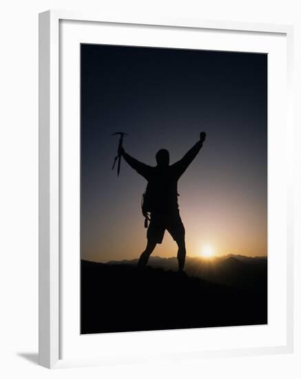 Mountain Climber Rejoices at the Summit at Sunrise-null-Framed Photographic Print