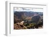 Mountain Goat Stands at the Edge of Bouldery Cliff at the Maroon Bells in Colorado-Kent Harvey-Framed Premium Photographic Print