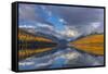 Mountain peaks reflect into Bowman Lake in autumn, Glacier National Park, Montana, USA-Chuck Haney-Framed Stretched Canvas