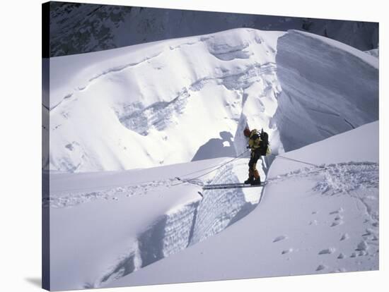 Mountaineer Crossingover a Crevase in the Khumbu Ice Fall, Nepal-Michael Brown-Stretched Canvas