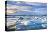 Mountains Behind Icebergs Locked in the Frozen Water of Jokulsarlon Lagoon-Neale Clark-Stretched Canvas