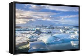 Mountains Behind Icebergs Locked in the Frozen Water of Jokulsarlon Lagoon-Neale Clark-Framed Stretched Canvas