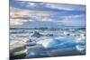 Mountains Behind Icebergs Locked in the Frozen Water of Jokulsarlon Lagoon-Neale Clark-Mounted Photographic Print