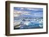 Mountains Behind Icebergs Locked in the Frozen Water of Jokulsarlon Lagoon-Neale Clark-Framed Photographic Print