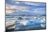 Mountains Behind Icebergs Locked in the Frozen Water of Jokulsarlon Lagoon-Neale Clark-Mounted Photographic Print