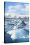Mountains Behind the Icebergs Locked in the Frozen Water of Jokulsarlon Iceberg Lagoon-Neale Clark-Stretched Canvas