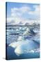 Mountains Behind the Icebergs Locked in the Frozen Water of Jokulsarlon Iceberg Lagoon-Neale Clark-Stretched Canvas