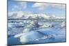 Mountains Behind the Icebergs Locked in the Frozen Water of Jokulsarlon Iceberg Lagoon-Neale Clark-Mounted Photographic Print