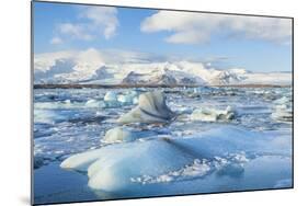 Mountains Behind the Icebergs Locked in the Frozen Water of Jokulsarlon Iceberg Lagoon-Neale Clark-Mounted Photographic Print